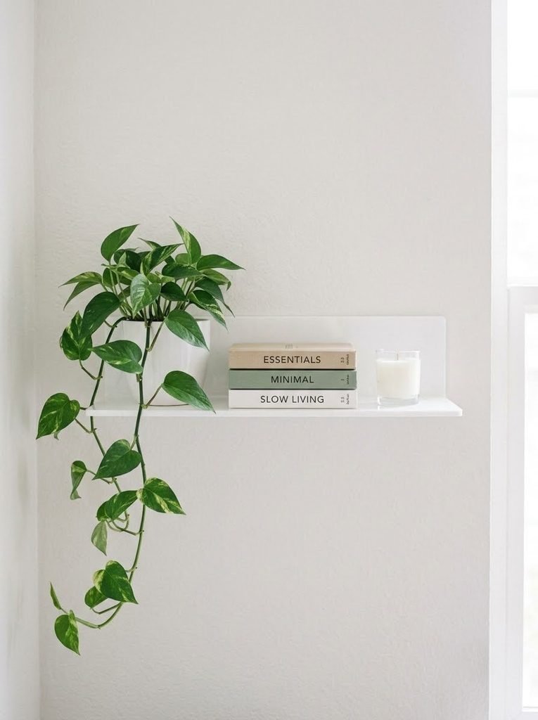 Styling lightweight floating shelves as renter-friendly wall decor.